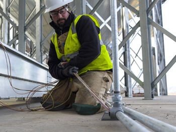 Main in construction gear working on an electrical installation project