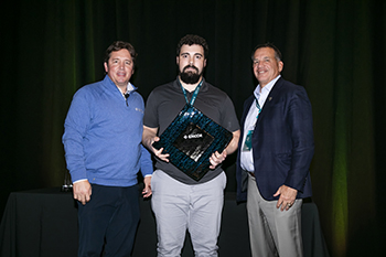 Company leadership with the award  